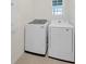 Bright laundry room with Samsung washer and dryer units at 1323 Berry Ln, Davenport, FL 33837