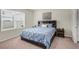 Bedroom featuring a window and a bed with a dark wood headboard at 1323 Berry Ln, Davenport, FL 33837