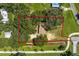 Aerial view of a property with lush trees and a lot line in a verdant, established neighborhood at 1341 W Belmar St, Lakeland, FL 33815