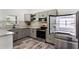 Kitchen featuring stainless steel refrigerator with french doors, and grey cabinets and countertops at 1341 W Belmar St, Lakeland, FL 33815