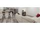 Open-concept living room and kitchen area with modern finishes and stylish furniture at 1341 W Belmar St, Lakeland, FL 33815