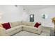 Bright living room with white walls, a corner sofa, and a stylish rug, creating a welcoming space at 1341 W Belmar St, Lakeland, FL 33815