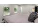 Main bedroom is bright and airy with two windows and calming wall color at 1341 W Belmar St, Lakeland, FL 33815