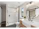 This modern bathroom is equipped with a glass-enclosed shower, a floating vanity, and stylish fixtures at 1455 Kelso Blvd, Windermere, FL 34786
