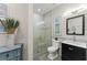 Bathroom featuring a glass shower and a black vanity at 1455 Kelso Blvd, Windermere, FL 34786