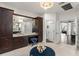 Bathroom with a vanity and stool, as well as a view of the home's open layout at 1455 Kelso Blvd, Windermere, FL 34786