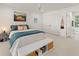 Bright bedroom with white walls, a ceiling fan, and a view to an ensuite bathroom at 1455 Kelso Blvd, Windermere, FL 34786