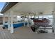 Boathouse interior featuring lifts for two boats under a clean, covered structure with recessed lighting at 1455 Kelso Blvd, Windermere, FL 34786
