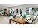 Dining room with large windows, a view of the water, and an open floor plan at 1455 Kelso Blvd, Windermere, FL 34786