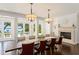 Bright dining room featuring a fireplace, and backyard view with pool at 1455 Kelso Blvd, Windermere, FL 34786