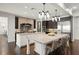 Gourmet kitchen showcasing a brick backsplash, stainless steel appliances, and granite countertops at 1455 Kelso Blvd, Windermere, FL 34786