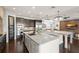 Spacious kitchen featuring granite countertops, stainless steel appliances, and stylish lighting at 1455 Kelso Blvd, Windermere, FL 34786