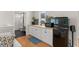 The modern kitchenette offers white cabinets, a wood countertop, a mini-fridge, and stainless steel hardware at 1455 Kelso Blvd, Windermere, FL 34786
