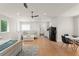 Open floor plan living area with kitchen, seating, bed, and dining space at 1455 Kelso Blvd, Windermere, FL 34786