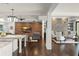 Open layout featuring a living room with wood paneling and fireplace at 1455 Kelso Blvd, Windermere, FL 34786