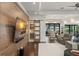 Living area with a wood accent wall, decorative sliding door and outside view at 1455 Kelso Blvd, Windermere, FL 34786