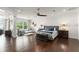 Large main bedroom with sitting area, wood floors, and ample natural light at 1455 Kelso Blvd, Windermere, FL 34786