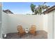 Outdoor patio featuring two chairs on a red brick surface at 1455 Kelso Blvd, Windermere, FL 34786