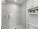 Clean shower with white tiling and modern fixtures at 1455 Kelso Blvd, Windermere, FL 34786