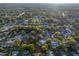 Aerial view highlighting a residential area with tree coverage and proximity to community pools at 146 Tollgate Trl, Longwood, FL 32750