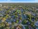 Location aerial view showing neighborhood homes with tree-lined streets and lush landscaping at 146 Tollgate Trl, Longwood, FL 32750