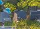 Aerial view of the property, revealing its proximity to a pool, neighboring homes, and lush green surroundings at 146 Tollgate Trl, Longwood, FL 32750
