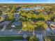 Aerial view showcasing the property within a leafy neighborhood near a scenic lake, highlighting community features at 146 Tollgate Trl, Longwood, FL 32750