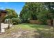 Beautiful backyard featuring a mix of green grass, garden beds and privacy fence at 146 Tollgate Trl, Longwood, FL 32750