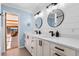 Modern bathroom showcasing dual sinks, sleek black fixtures, and stylish mirrors at 146 Tollgate Trl, Longwood, FL 32750
