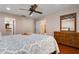 Primary bedroom showcasing wood floors, ceiling fan, and natural lighting at 146 Tollgate Trl, Longwood, FL 32750