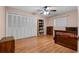Bedroom features a ceiling fan, window, closet, and wood laminate floors at 146 Tollgate Trl, Longwood, FL 32750