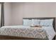 Comfortable bedroom featuring a queen-size bed with decorative quilt and throw pillows at 146 Tollgate Trl, Longwood, FL 32750