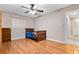 This bedroom features a ceiling fan, hardwood floors and a view of the closet at 146 Tollgate Trl, Longwood, FL 32750