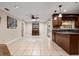 Large dining space featuring tile floors, updated lighting, built in shelving, and views of the backyard at 146 Tollgate Trl, Longwood, FL 32750