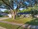 Well-maintained home with a green lawn and a large tree providing shade and curb appeal at 146 Tollgate Trl, Longwood, FL 32750