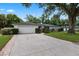 Charming single story home featuring a large garage, brick lined driveway, and well-manicured landscaping at 146 Tollgate Trl, Longwood, FL 32750