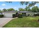 Inviting single-story house with a manicured lawn and mature landscaping adding to the curb appeal at 146 Tollgate Trl, Longwood, FL 32750