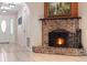 Cozy fireplace with brick surround, perfect for creating a warm and inviting atmosphere at 146 Tollgate Trl, Longwood, FL 32750