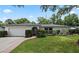 Charming single-story home with well-manicured lawn, inviting entrance, and attached two-car garage at 146 Tollgate Trl, Longwood, FL 32750