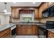 The kitchen features granite countertops, modern appliances, and ample storage for a chef's delight at 146 Tollgate Trl, Longwood, FL 32750