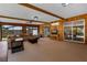 Bright and airy living room with wooden ceiling beams and sliding glass doors at 146 Tollgate Trl, Longwood, FL 32750