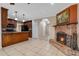 The living room features a brick fireplace and seamlessly connects to the kitchen with granite countertops at 146 Tollgate Trl, Longwood, FL 32750