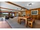 Spacious living room with wood paneling, ceiling beams and plenty of natural light at 146 Tollgate Trl, Longwood, FL 32750