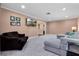Comfortable living room featuring neutral paint, carpet, with tv and couch at 146 Tollgate Trl, Longwood, FL 32750