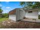 Backyard shed provides extra storage space and complements the surrounding landscape at 146 Tollgate Trl, Longwood, FL 32750