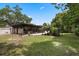 Enclosed sunroom in backyard offers an extension to the home with plenty of natural light at 146 Tollgate Trl, Longwood, FL 32750