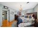 Comfortable bedroom with hardwood floors, a large chandelier, and stylish décor at 1516 Arthur St, Orlando, FL 32804