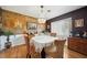 Elegant dining room featuring a chandelier, wood floors, and decorative wall sconces at 1516 Arthur St, Orlando, FL 32804