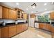Well-lit kitchen with granite countertops, light wood cabinetry, and modern appliances at 1516 Arthur St, Orlando, FL 32804