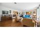 Bright living room showcasing hardwood floors, comfortable seating, and an open floor plan at 1516 Arthur St, Orlando, FL 32804